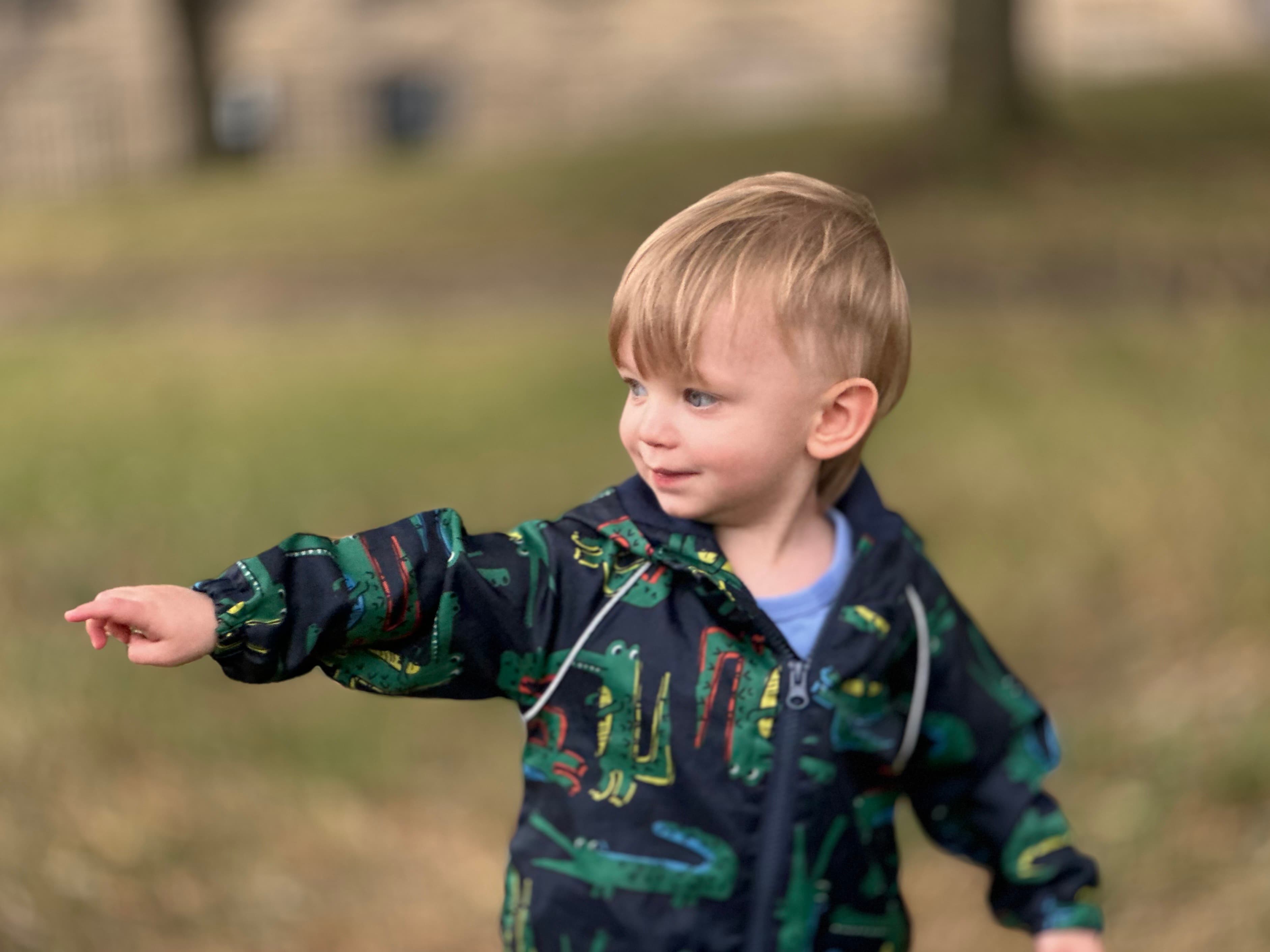 Noa pointing, showing his curiosity and engagement with the world
