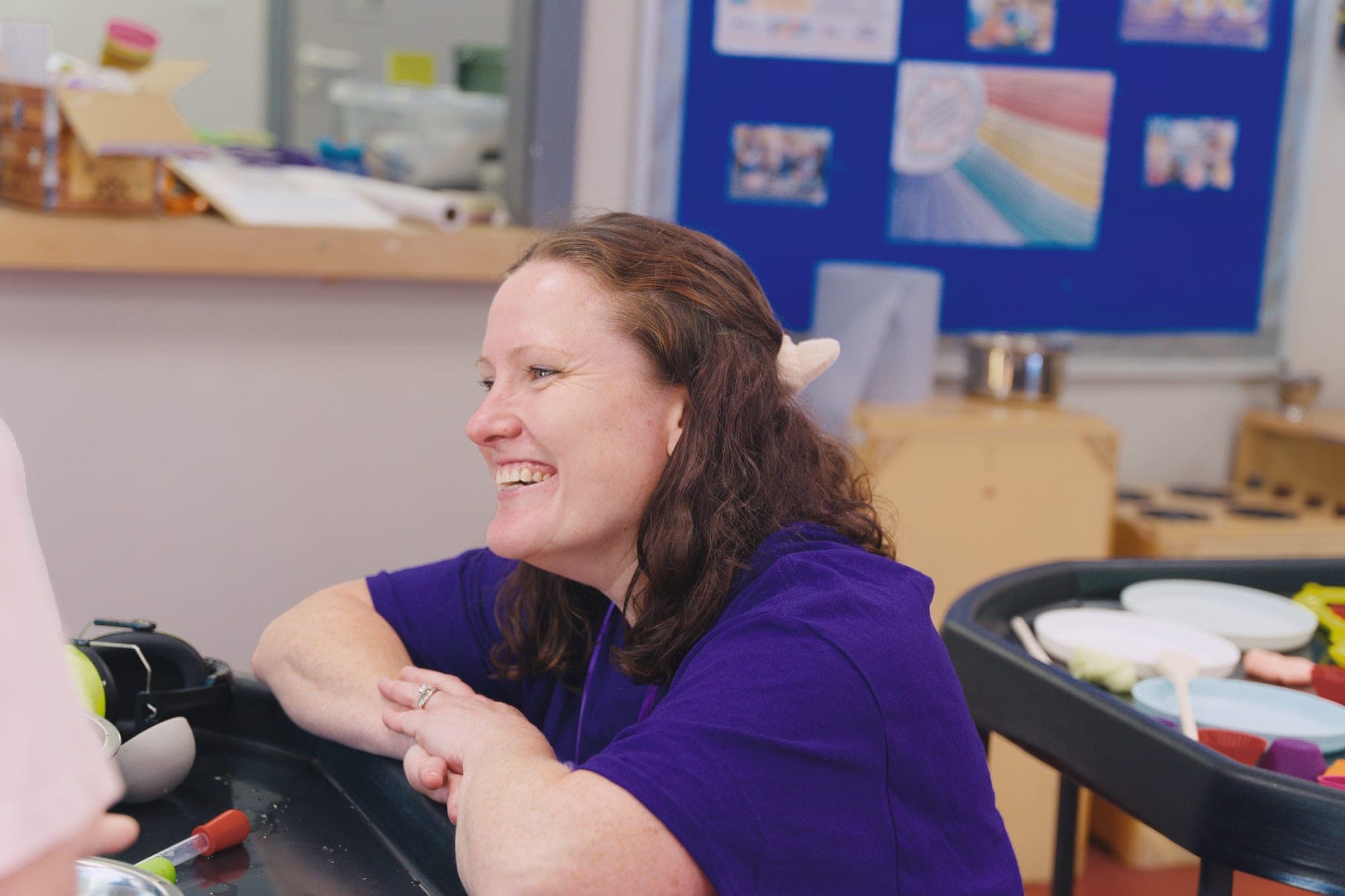 A Noa's Place team member smiling during a sensory play session